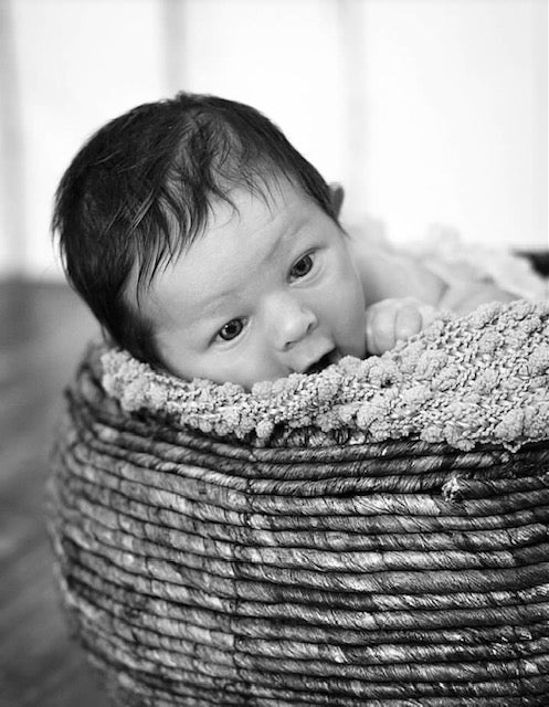 Image by Jolanta Wulf Photography. Baby in a basket