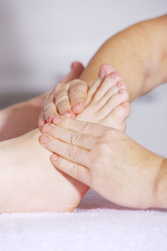 image by andreas160578 at pixabay. Foot massage for aching feet.