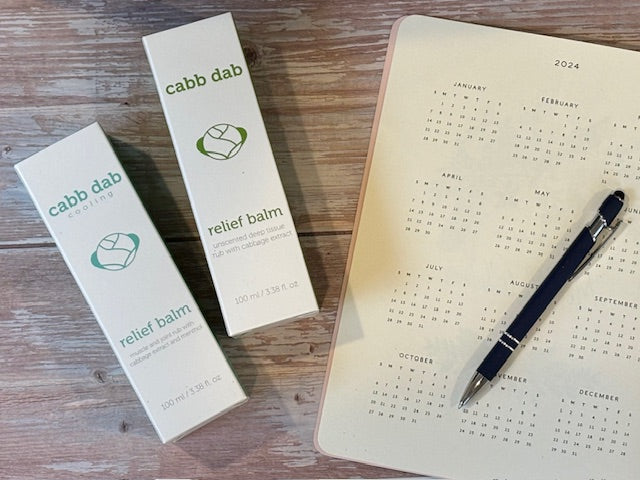 cabb dab relief balm with a 2024 calendar and pen